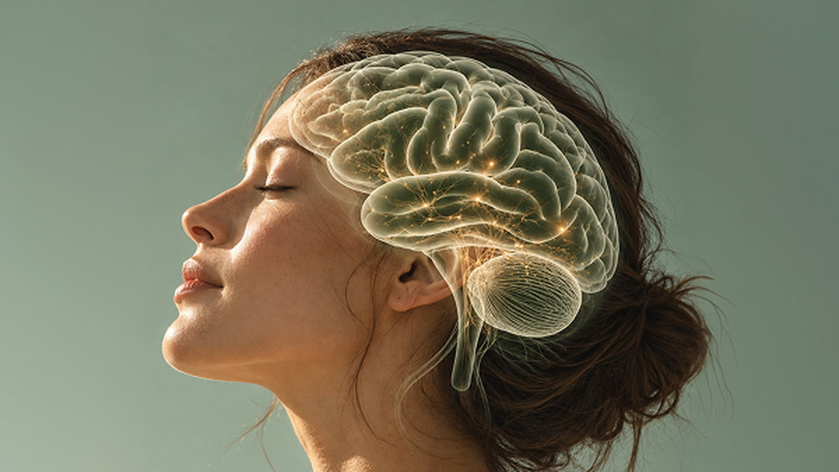 A woman in profile with an illustration of the brain over her head